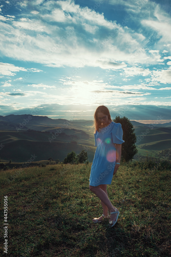 Woman in blue dress in Altai mountain,