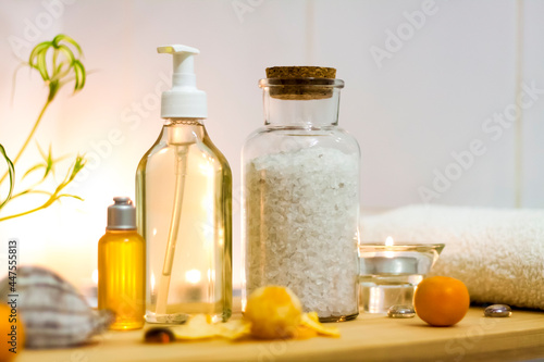 Spa-beauty salon  wellness center. Spa treatment aromatherapy for a woman s body in the bathroom with candles  oils and salt.