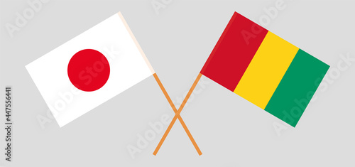 Crossed flags of Japan and Guinea. Official colors. Correct proportion