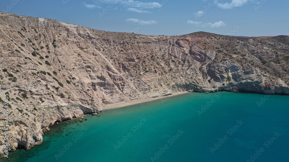 Aerial drone photo of secluded paradise sandy beach of Kalamos mostly covered by perlite rock only accessible by boat, Milos island, Cyclades, Greece