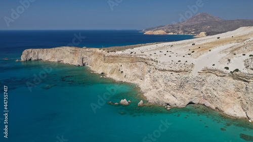 Aerial drone photo of beautiful volcanic emerald paradise bay below white rock with perlite mine, Milos island, Cyclades, Greece