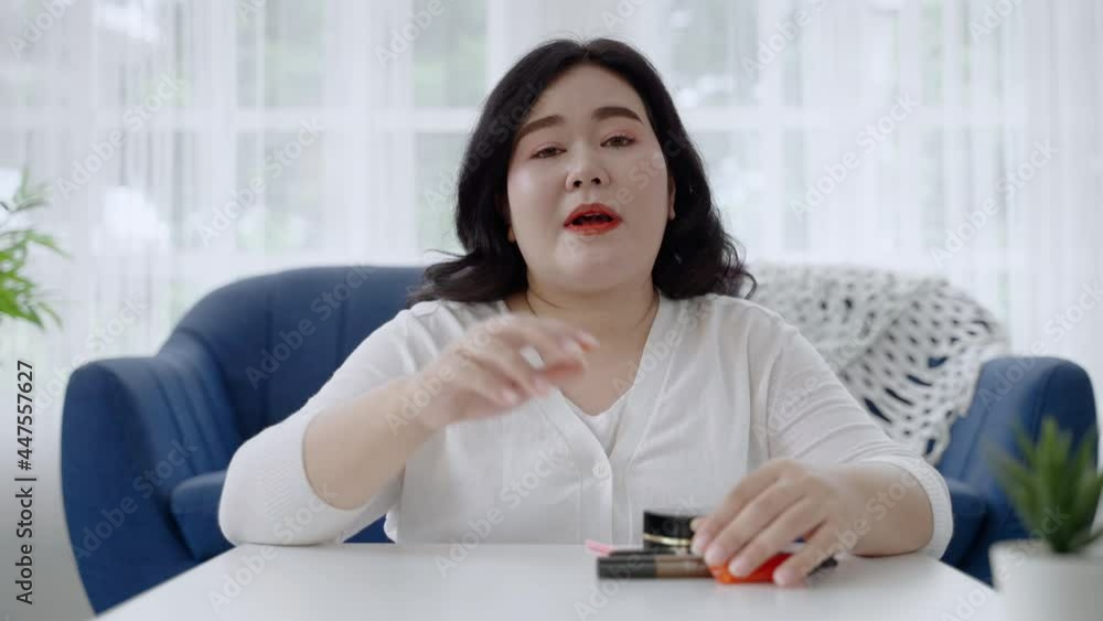 plus size Asian woman bloggers sitting are online to review cosmetic products via social media. concept of health and beauty
plus size Asian woman bloggers sitting are online to review cosmetic products via social media. concept of health and beauty