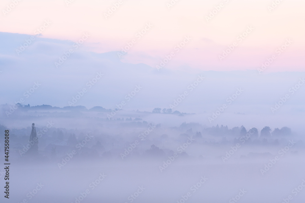 Morning view of Bystricka village shrouded in fog, Slovakia.