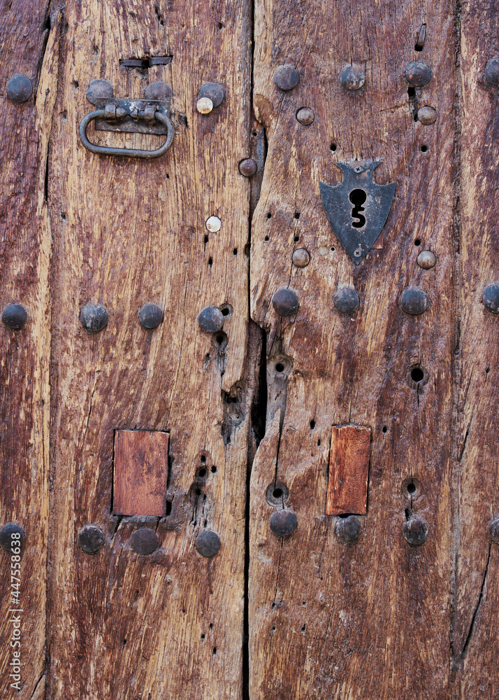 Antique wooden door with rusted hardware Antique wooden door with rusted hardware