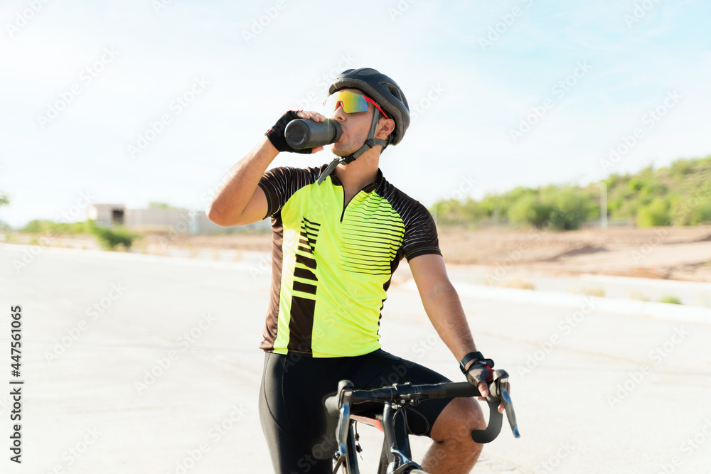 Sweaty young man riding his bicycle outdoors Sweaty young man riding his bicycle outdoors