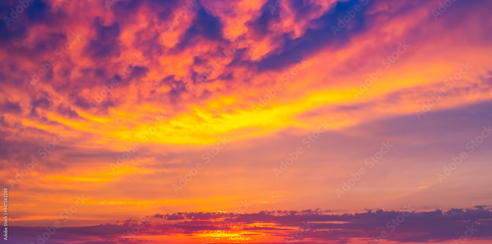 Dramatic bright sky at sunset. Panorama, background for text. Blurred focus