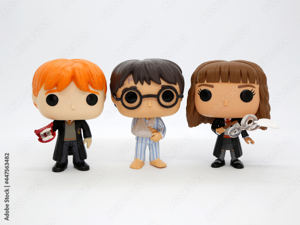 Harry Potter, Hermione Granger and Ron Weasley Funko pop. Harry in his  pajamas with a broken arm. Characters from the Harry Potter books and  movies. J. K. Rowling. Toys. Collectible. Stock Photo