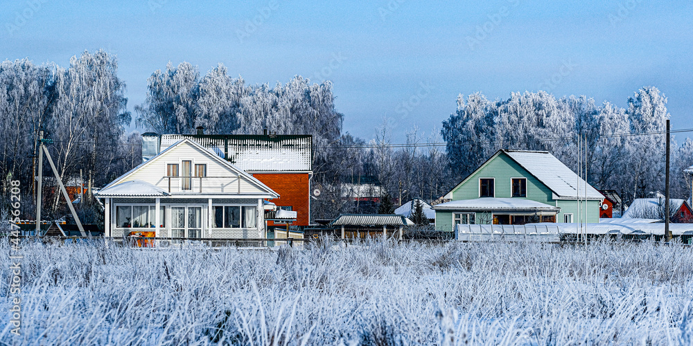 Country winter landscape with the image of village
