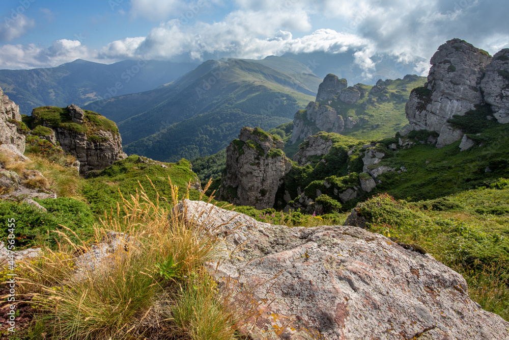 Landscape of Babin zub peak on Stara planina (Balkan mountains) in summer time. Track to highest point Midzor in Serbia in background