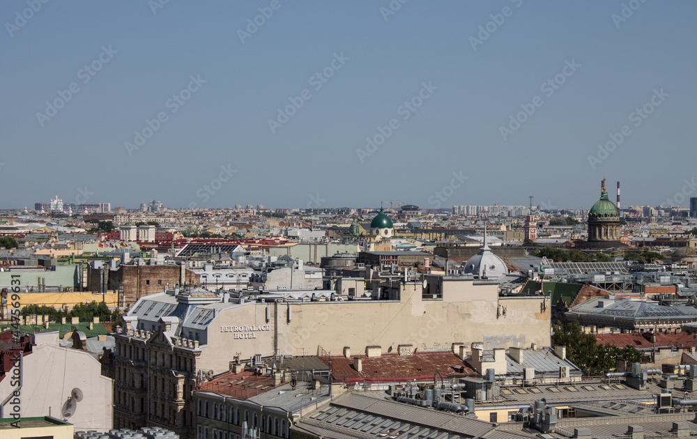 panoramic view of the roofs of the historical buildings of the city from the observation deck of St. Isaac's Cathedral on a clear sunny summer day and a copy space in Saint-Petersburg