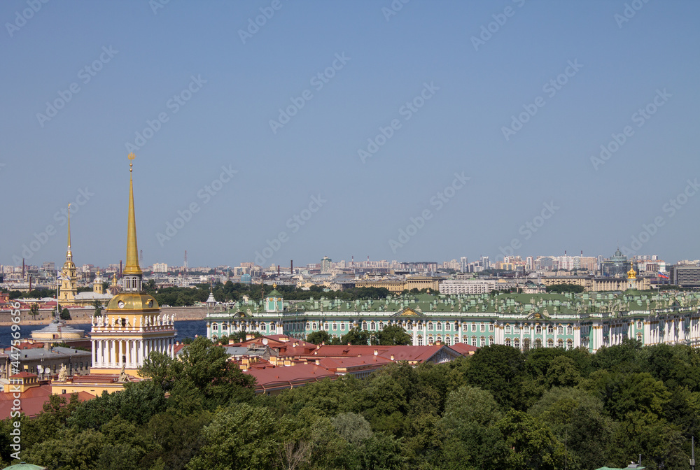 Panoramic top view of historical buildings-the Winter palace and the Admiralty spire among the green foliage of trees on a sunny summer day and a space for copying