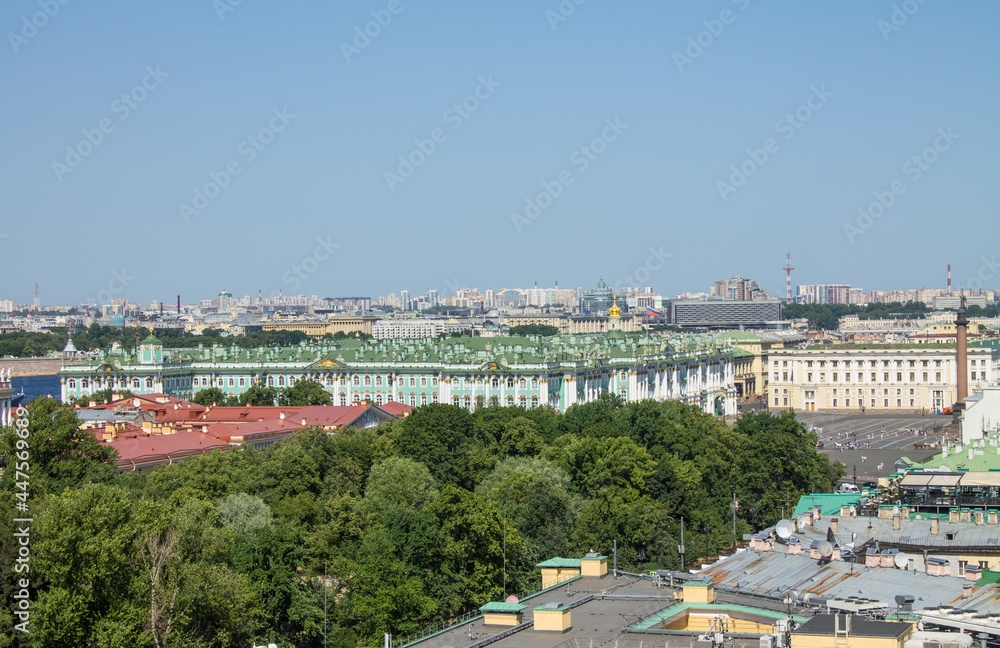 Panoramic top view of historical buildings-the Winter palace and the Admiralty spire among the green foliage of trees on a sunny summer day and a space for copying
