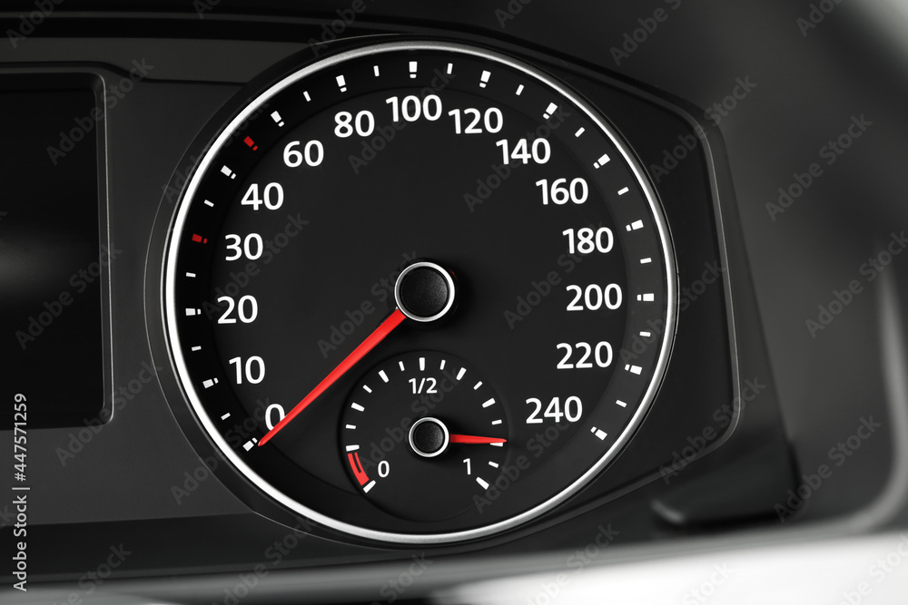 Speedometer on modern car dashboard, closeup view Speedometer on modern car dashboard, closeup view