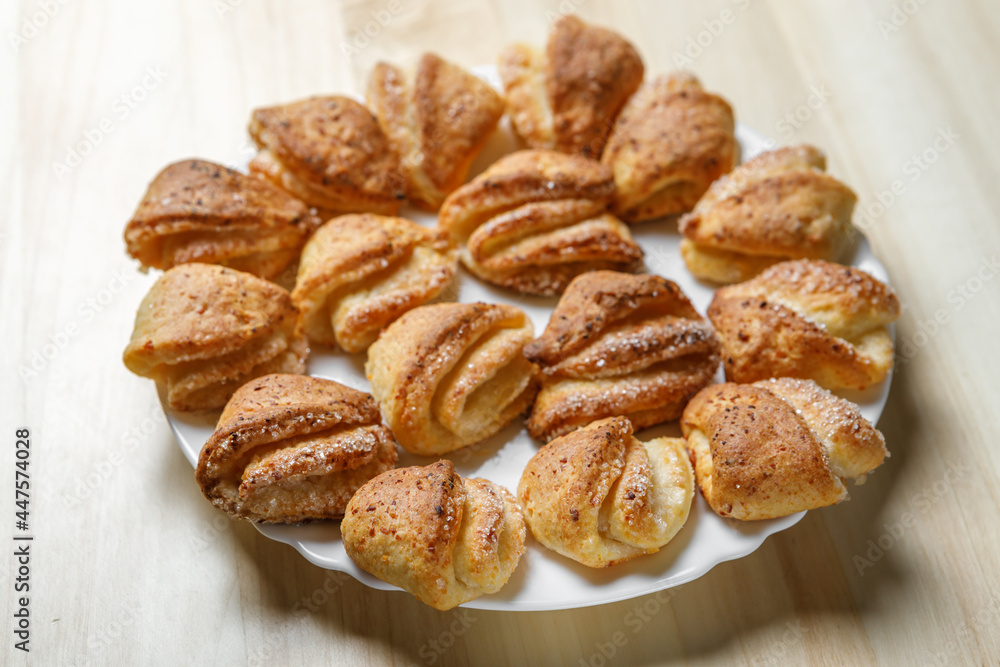 Freshly prepared pastries with a crispy crust are on a plate.