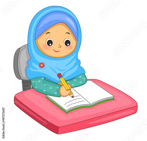 muslim girl writing in a book