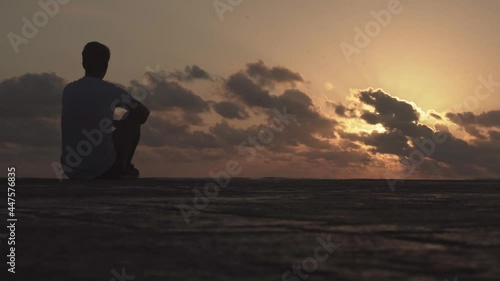 Wallpaper Mural young man meditates at dawn Torontodigital.ca