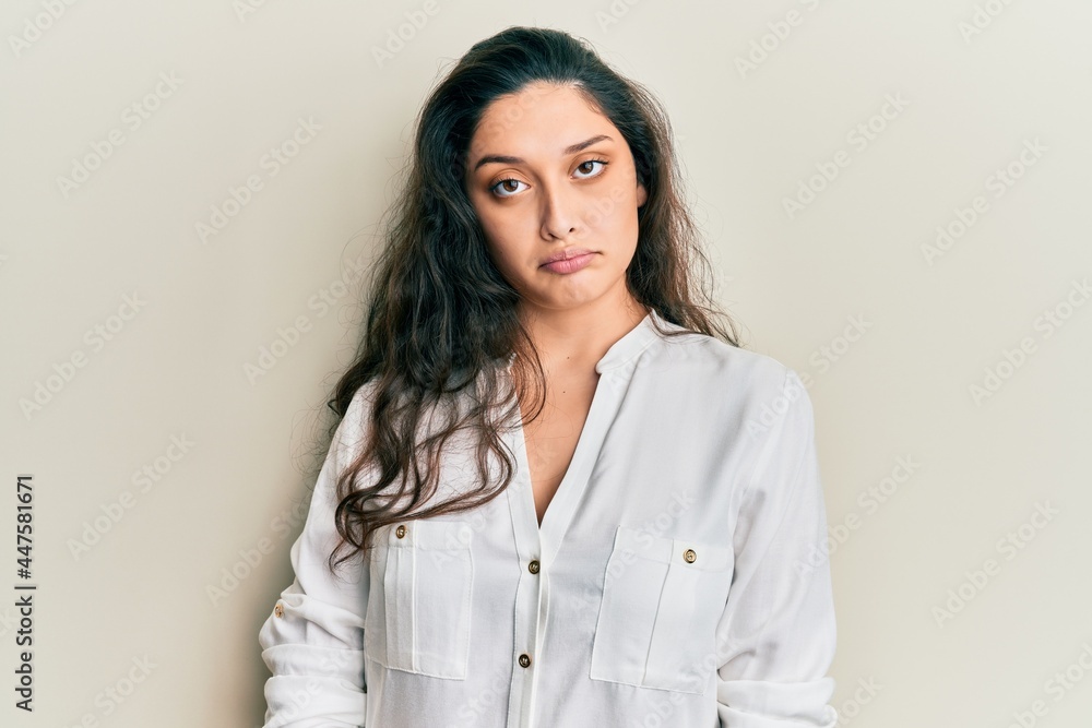 Beautiful middle eastern woman wearing casual clothes depressed and worry for distress, crying angry and afraid. sad expression.