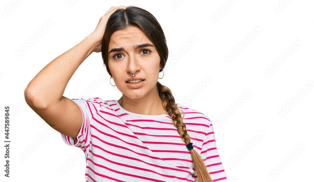 Young hispanic woman wearing casual clothes confuse and wonder about question. uncertain with doubt, thinking with hand on head. pensive concept. Young hispanic woman wearing casual clothes confuse and wonder about question. uncertain with doubt, thinking with hand on head. pensive concept.