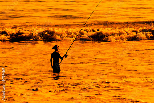 Surf Fishing on sunset beach in California