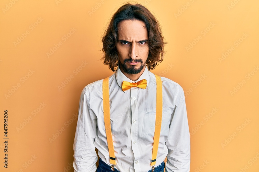 Young hispanic man wearing hipster elegant look skeptic and nervous, frowning upset because of problem. negative person. Young hispanic man wearing hipster elegant look skeptic and nervous, frowning upset because of problem. negative person.