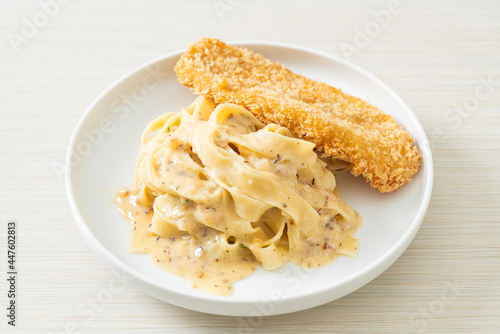 fettuccine pasta white cream sauce with fried fish