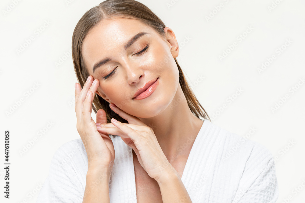 Young beautiful caucasian woman closing her eyes feeling relaxed with hands touching face on isolated white studio background Young beautiful caucasian woman closing her eyes feeling relaxed with hands touching face on isolated white studio background