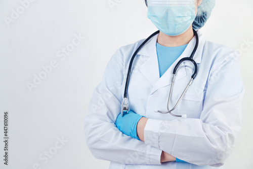 Professional doctor doing arms crossed gesture for build confidence in patients on white background. Medcial personnel and Health people concept. Copy space photo