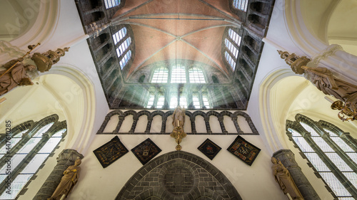 Beautiful ray of light from a stained glass window in the cathedral of Bruges in Belgium

