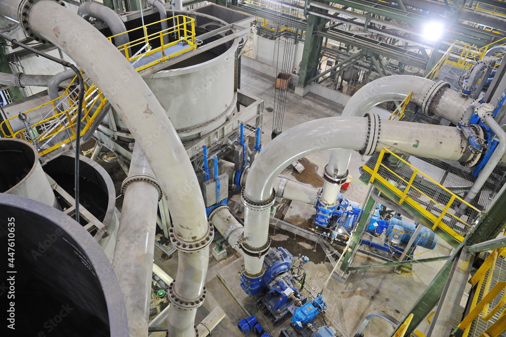 Pavlodar region, Kazakhstan - 12.10.2015 : Pipes and tanks with a centrifuge for processing sulfide ore