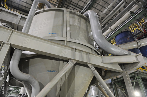 Pavlodar region, Kazakhstan - 12.10.2015 : Pipes and tanks with a centrifuge for processing sulfide ore photo