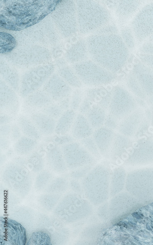 Underwater shallow beach with rocks, 3D empty blue water pool, vertical copy space for summer promotion