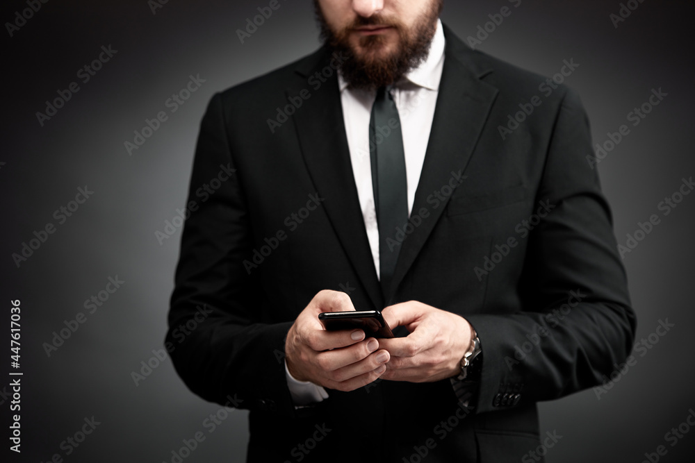 Businessman using smart phone in hands Businessman using smart phone in hands