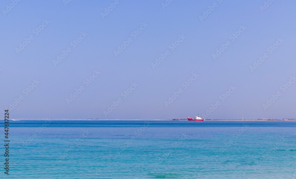 Shot of an industrial ship in blue waters. Transport