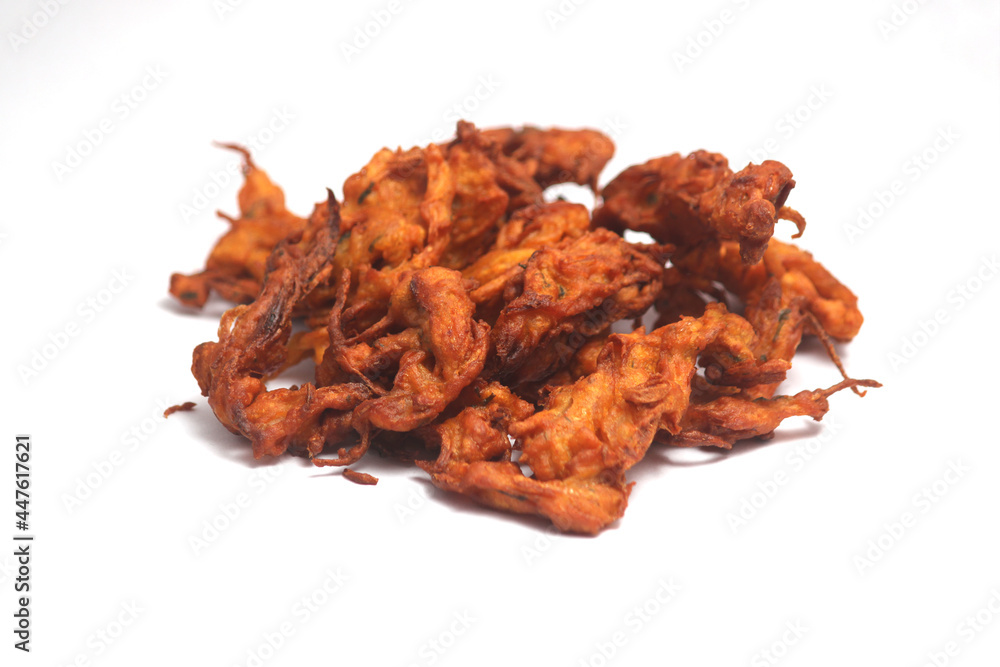Fried onion pakora or Pyaj Pakoda also known as Crispy Kanda bhaji, Bhajji, bajji, favourite Indian Tea-Time snack during the rainy season. served with tomato ketchup Fried onion pakora or Pyaj Pakoda also known as Crispy Kanda bhaji, Bhajji, bajji, favourite Indian Tea-Time snack during the rainy season. served with tomato ketchup