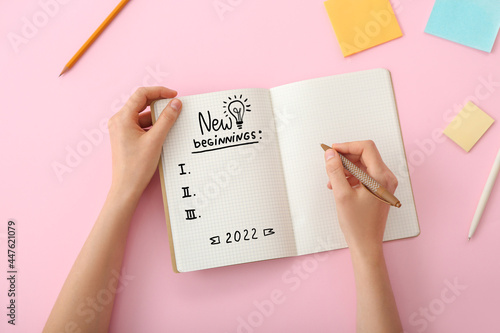 Young woman with notebook m...