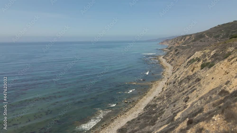 Cinematic aerial shot of sheer cliff over Pacific ocean in Southern California Cinematic aerial shot of sheer cliff over Pacific ocean in Southern California