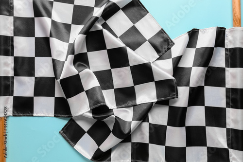 Racing flags on color background, closeup