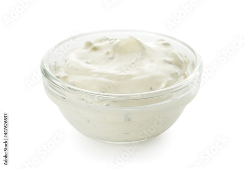 Glass bowl with tasty tartare sauce on white background
