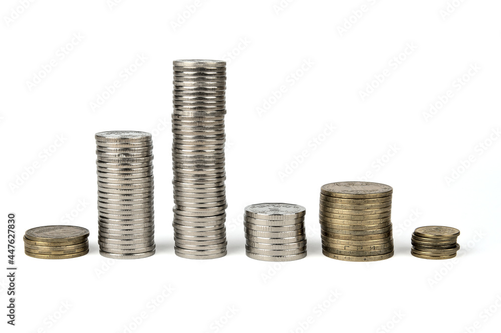 Coins of white and yellow metal are stacked in columns. A row of coins stacked in columns. Coins of Ukraine Coins of white and yellow metal are stacked in columns. A row of coins stacked in columns. Coins of Ukraine