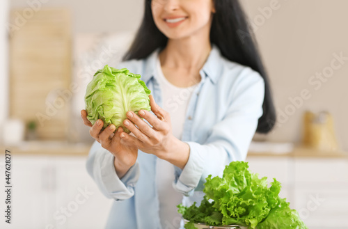 Young woman with fresh cabb...
