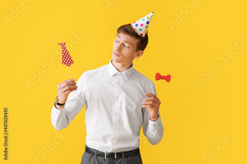 Handsome man with party dec...