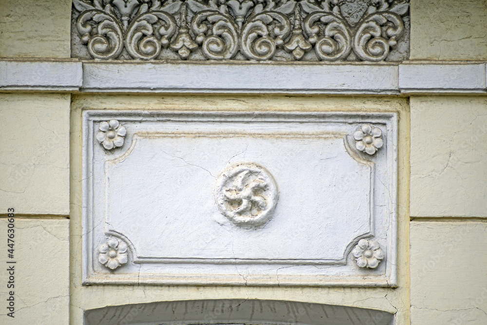 A fragment of stucco on the facade of a historical building