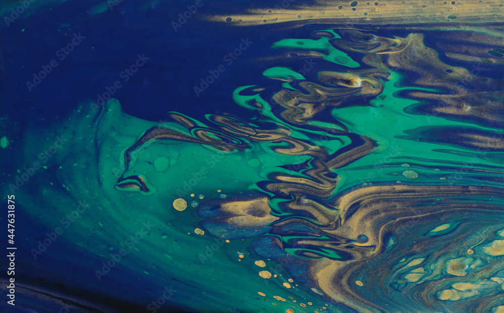 art photography of abstract marbleized effect background. Blue, green, gold and black creative colors. Beautiful paint.