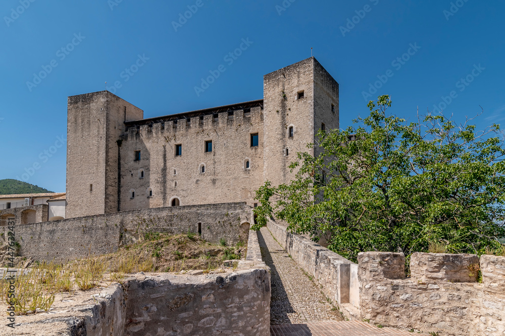 The Rocca Albornoziana overlooking the historic center of Spoleto, Italy, on a sunny day