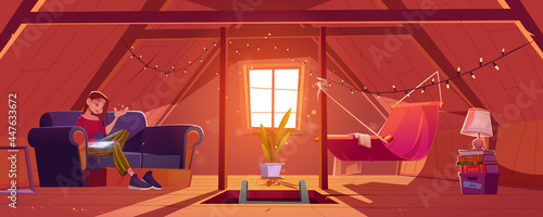 Young woman at home attic writing notes in notepad