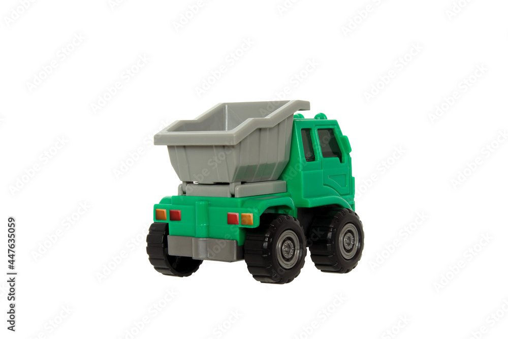 Fototapeta premium Toy dump truck for kids to play and enhance their learning Green truck with gray tray isolated on a withe background with clipping path