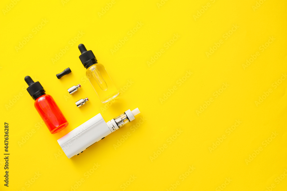 Vape mod with oil on color background Vape mod with oil on color background