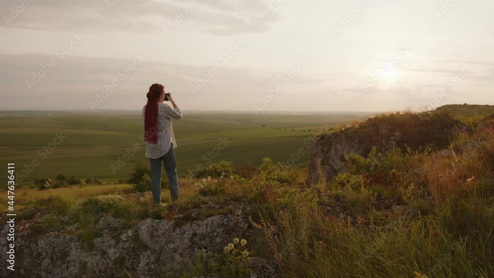 Back side photographer taking photos of nature