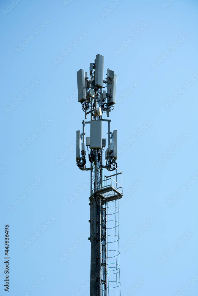 Cellular communication on the pole. High-rise telephone pole in a field in the countryside. Cellular communication on the pole. High-rise telephone pole in a field in the countryside.