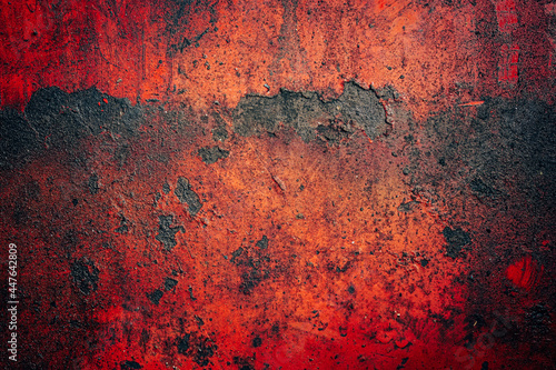 Old red matal sheet with rust and oily in the garage can be use as background 